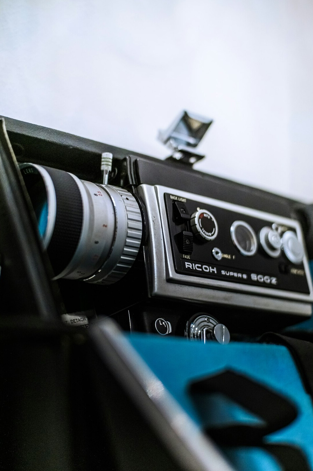 Vintage television camera in a retro studio set with stage lights