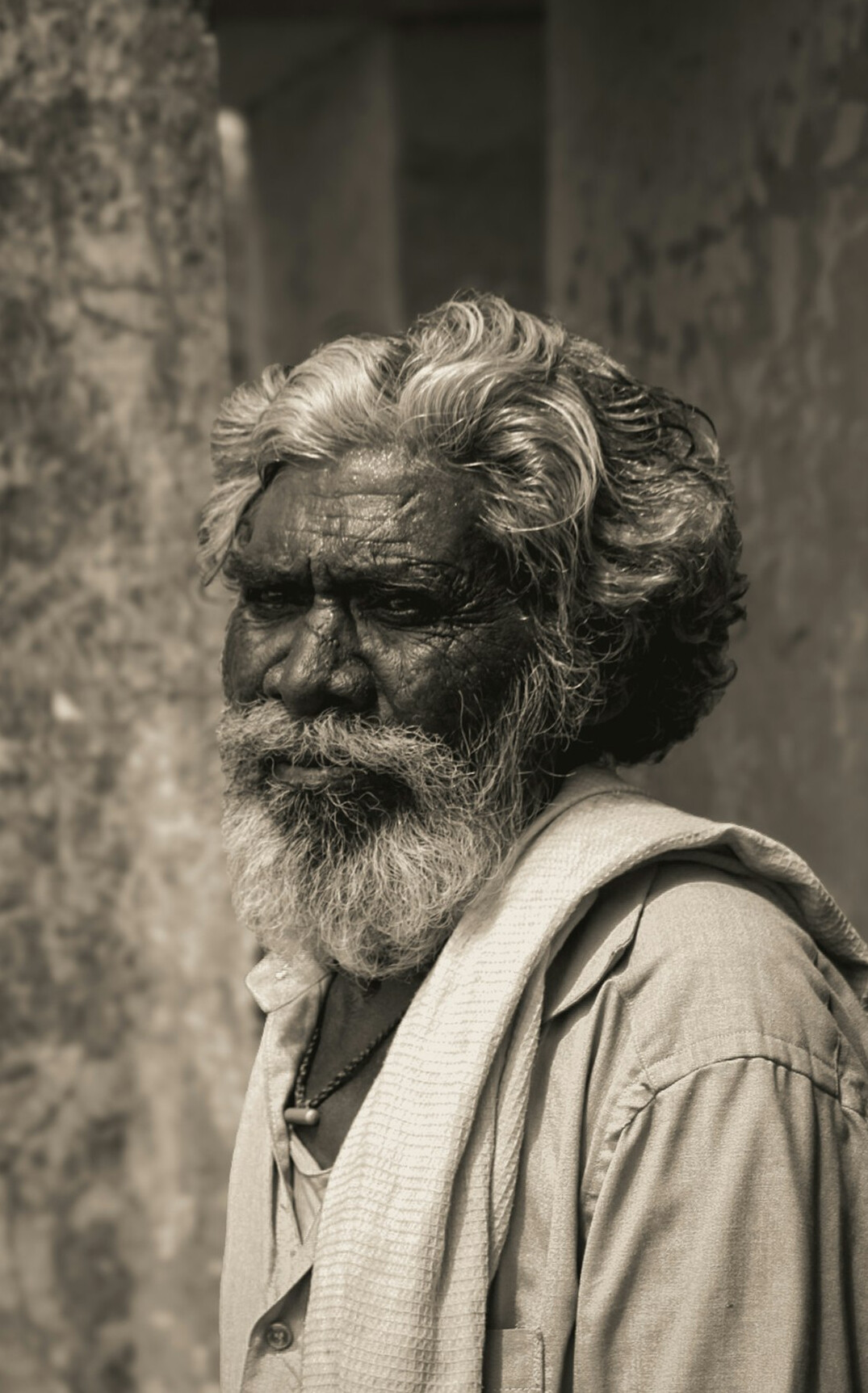 Studio portrait of a Portuguese man in his sixties, film archivist